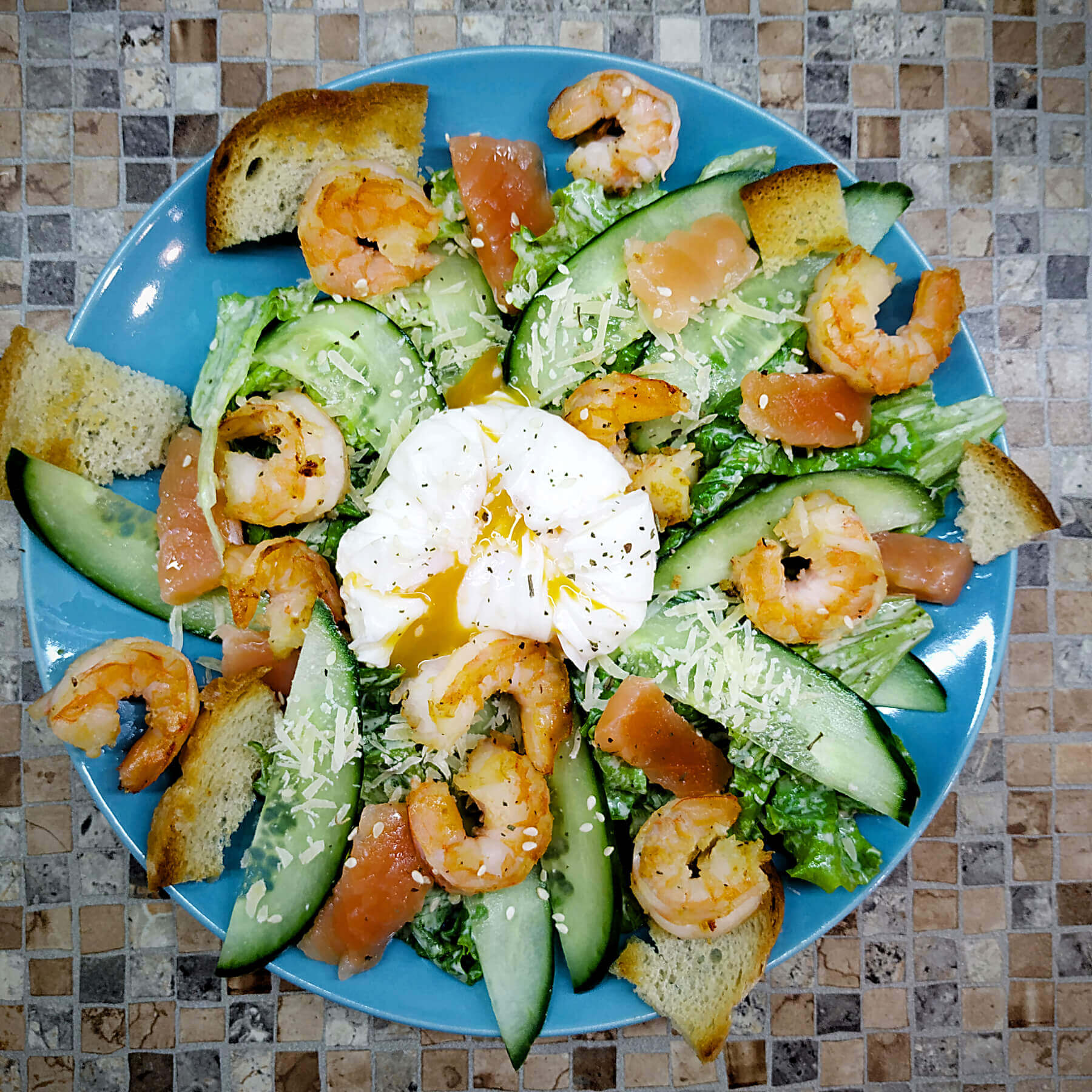 Shrimp salad with poached egg and salmon